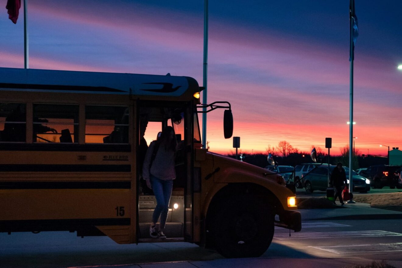 Yukon High School students are dropped off in front of the school as the sun rises, around 7:15 a.m. Studies show that high school students typically perform better when school starts at 8:30 a.m., allowing them to get more sleep.